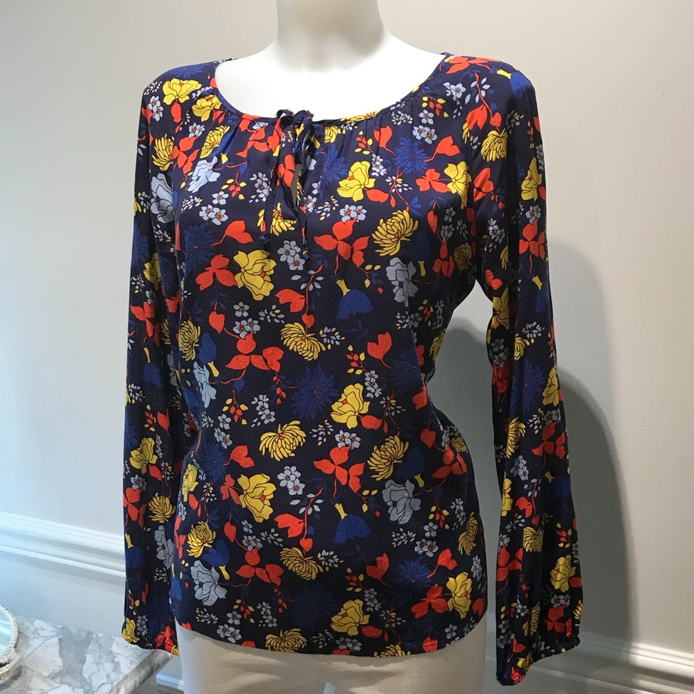 Charming Q Mack floral bright colored blouse.